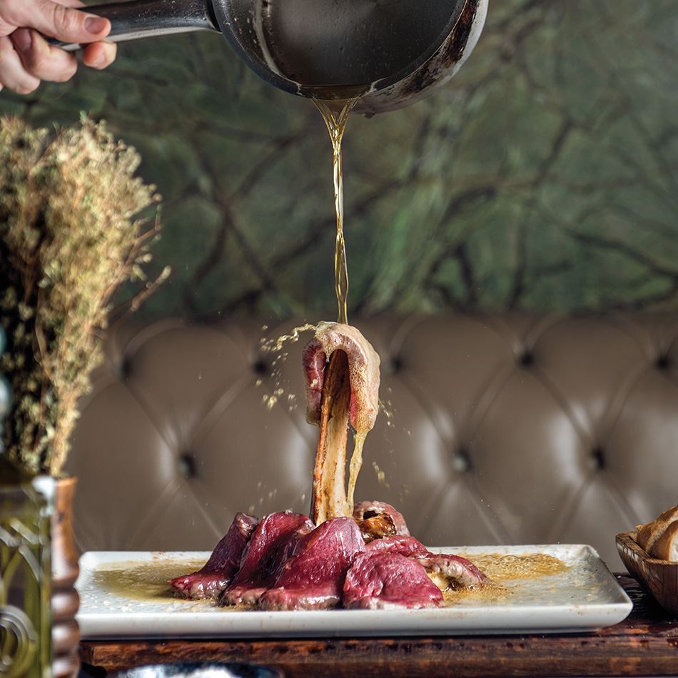 The Nusr-Et Special, a tableside-prepared, tender steak served sizzling in creamy butter.