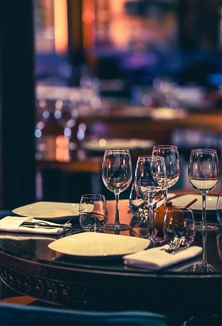 Close-up of Nusr-Et New York Midtown table setup with glasses and plates, perfect for intimate gatherings and corporate events.