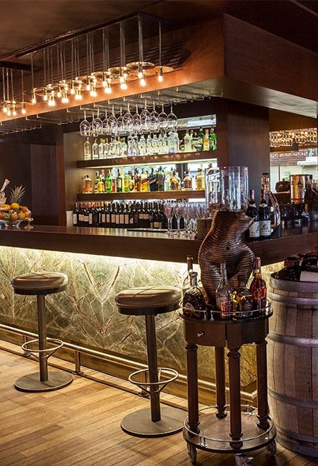 Luxury bar at Nusr-Et Ankara showcasing a wide selection of premium spirits and a stylish, modern ambiance